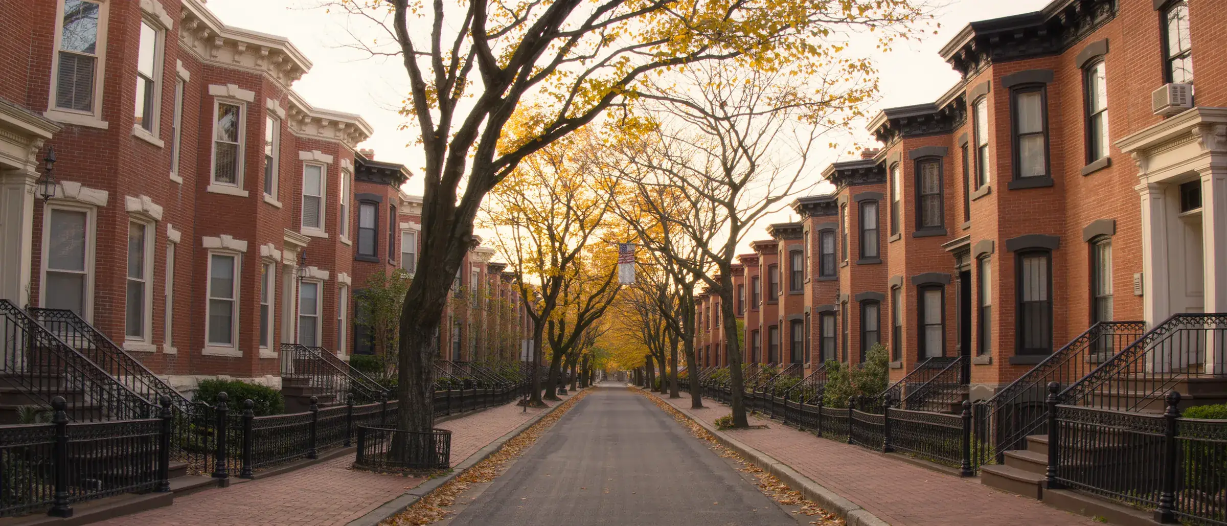 Brick Italianate homes on a brick street in Columbus
